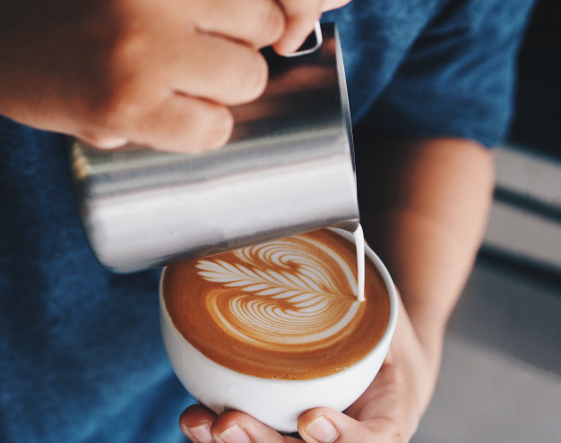 Barista Pouring Milk